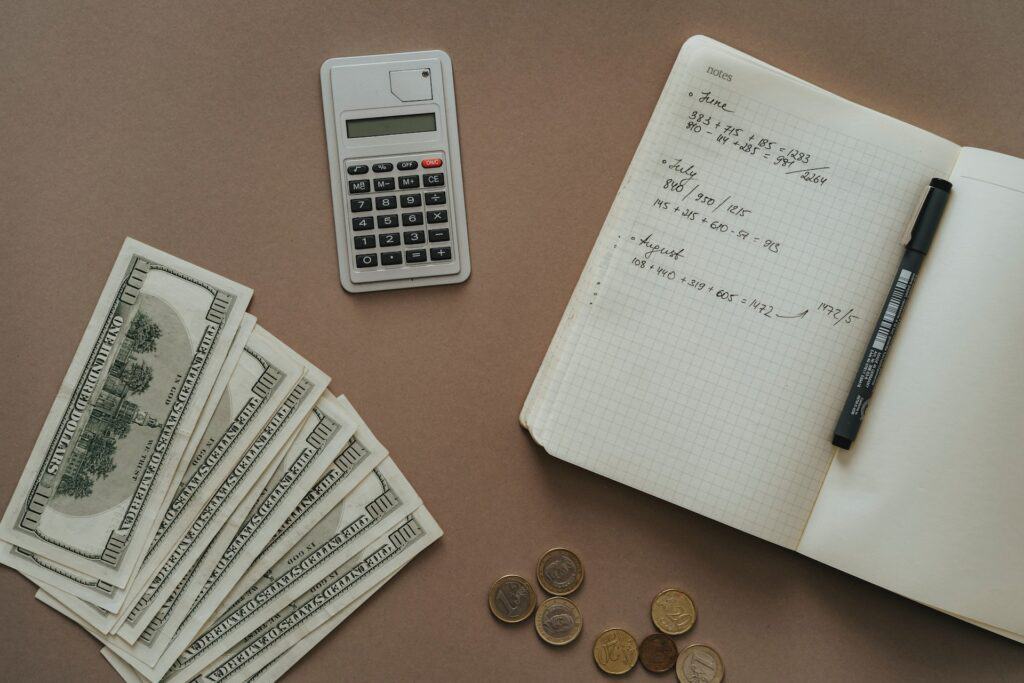 A business savings account with a calculator and coins