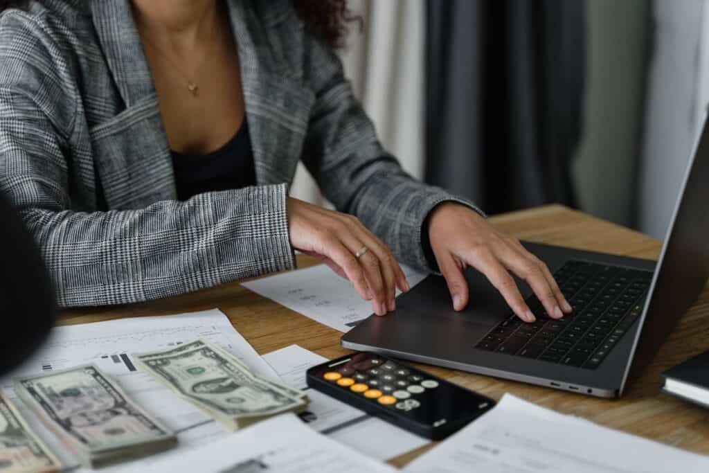 A business savings account with a laptop and coins